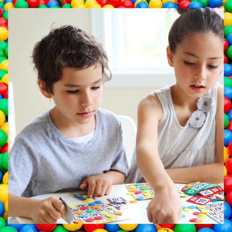 Two concentrating children play BINGO together