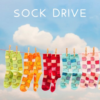 Colorful socks hanging on a clothes line.