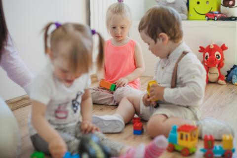 Children play with toys in a group