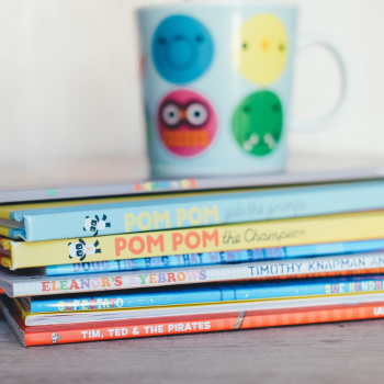 A multi-colored stack of children's books