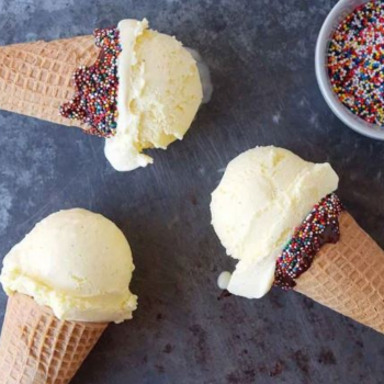 Three waffle cones with vanilla frozen custard.