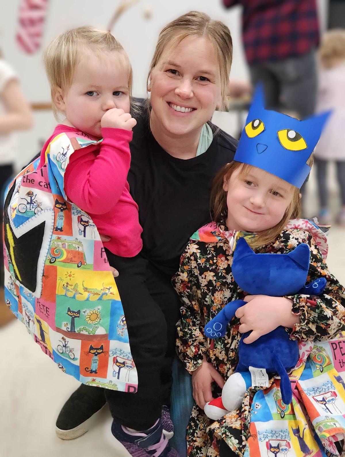 Mother with two children in Pete capes