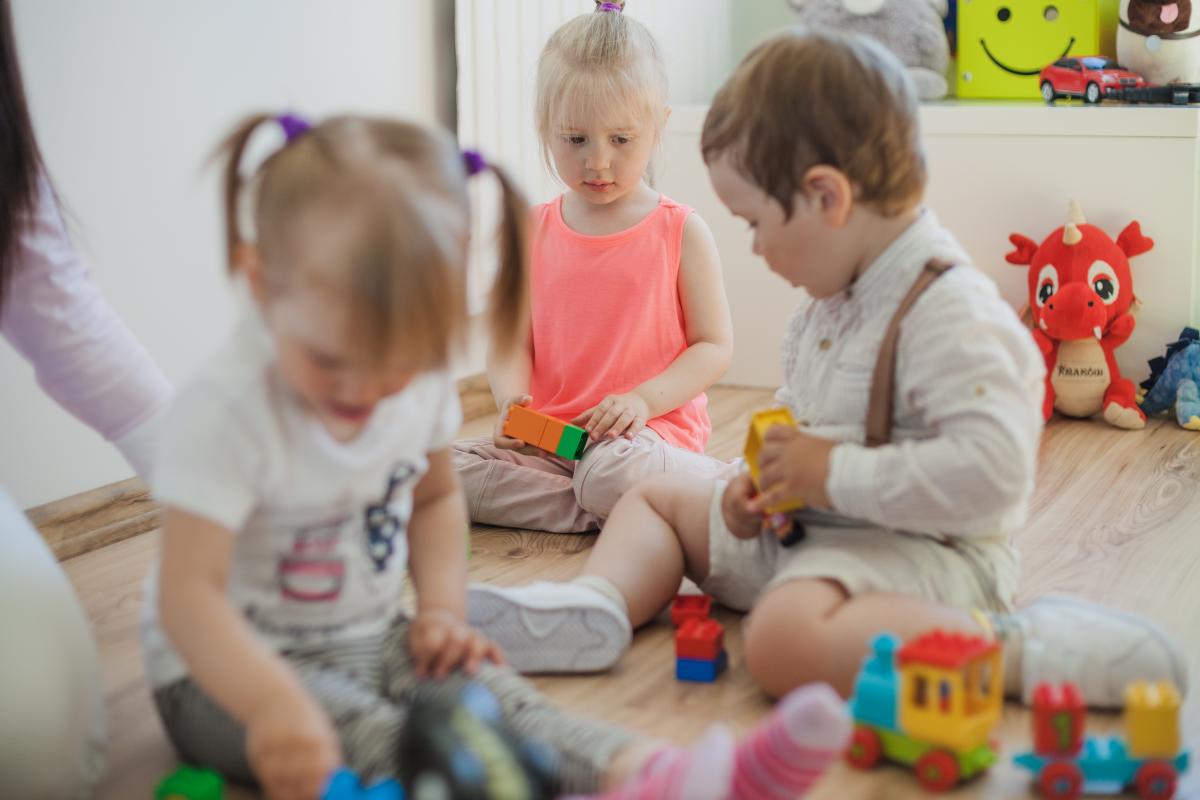 Children play with toys in a group