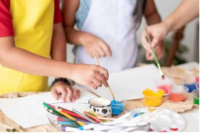 children painting at table